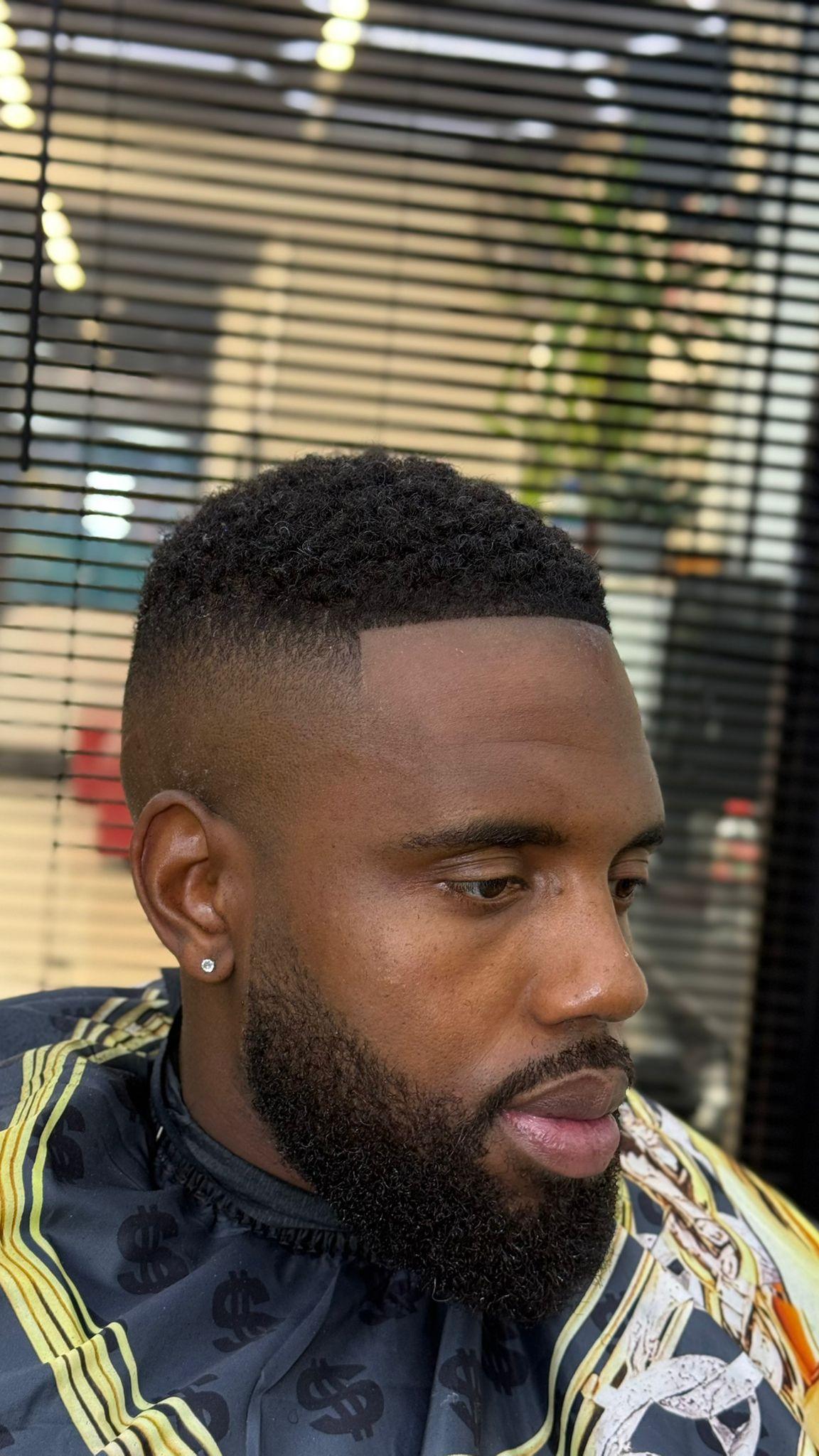 Clean fade with beard sculpt